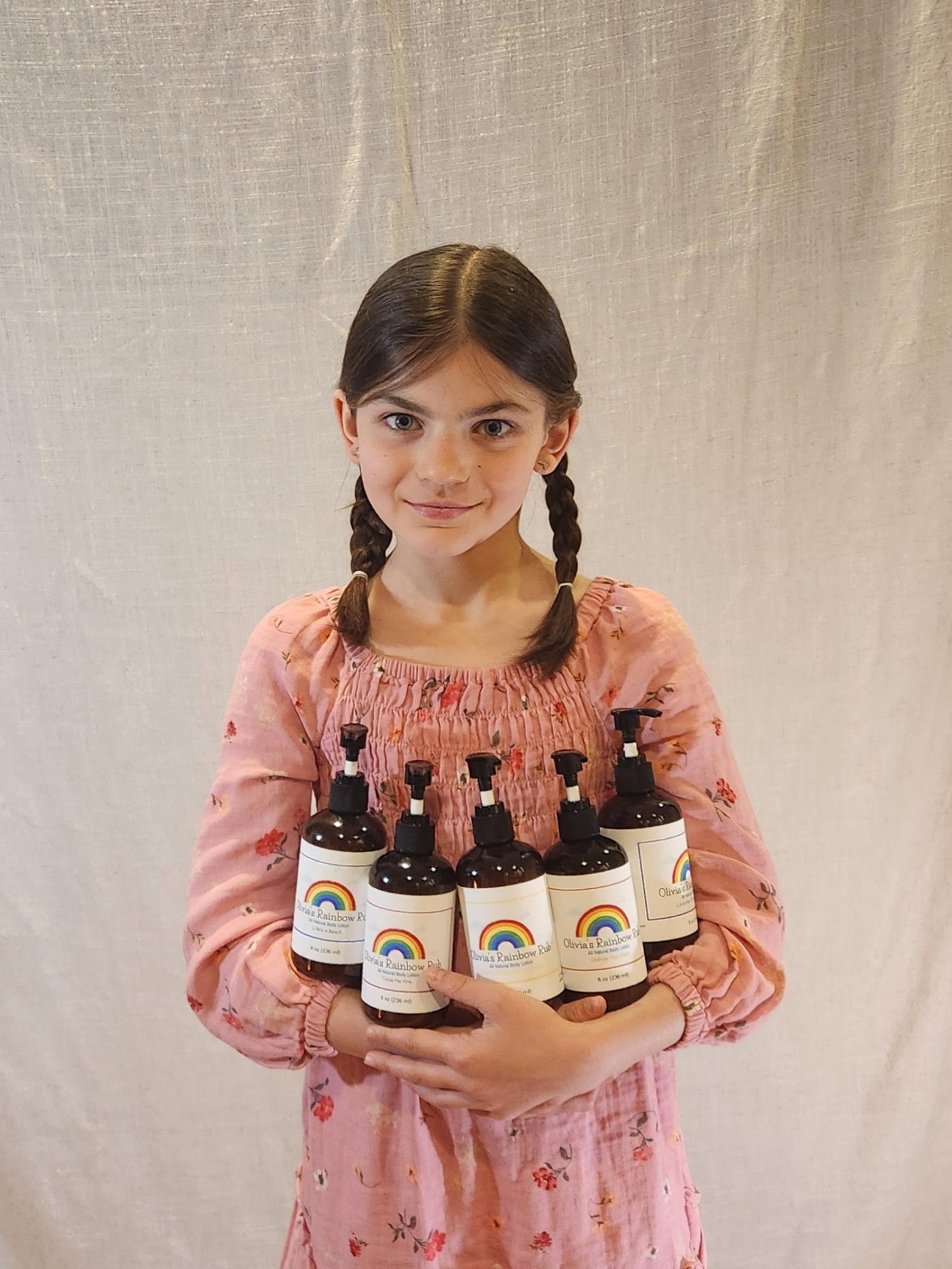 Olivia Holding Rainbow of Lotions